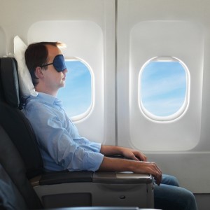 sleeping on plane-shutterstock_119470189-small